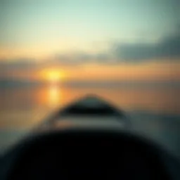 A serene landscape of a boat on a calm lake during sunset.